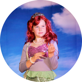 Little girl dressed as Ariel in a performance